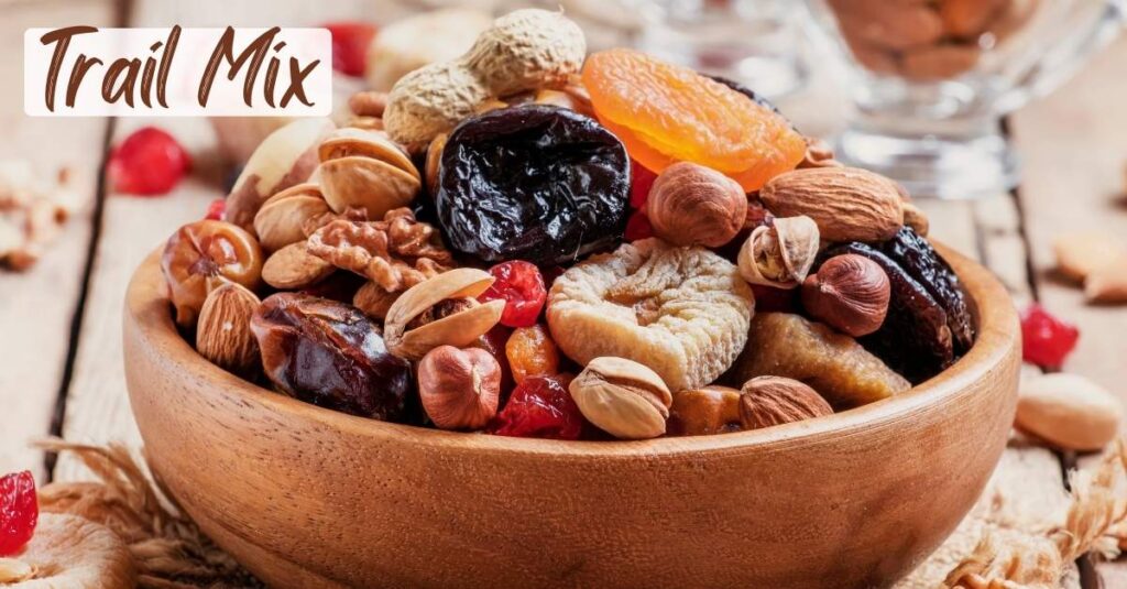 a bowl of nuts with heeading of trail mix